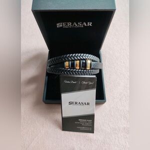 Serasar bracelet black and gold. New in box